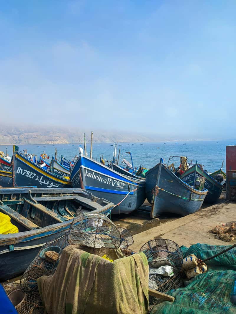 Traditional blue fishing boats in Agadir harbor Morocco