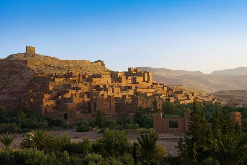 Ait Benhaddou fortified village with High Atlas Mountains backdrop - UNESCO World Heritage site near Marrakech showcasing traditional Berber architecture